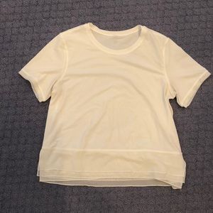 White lulu lemon crop top. Sheer bottom detail.